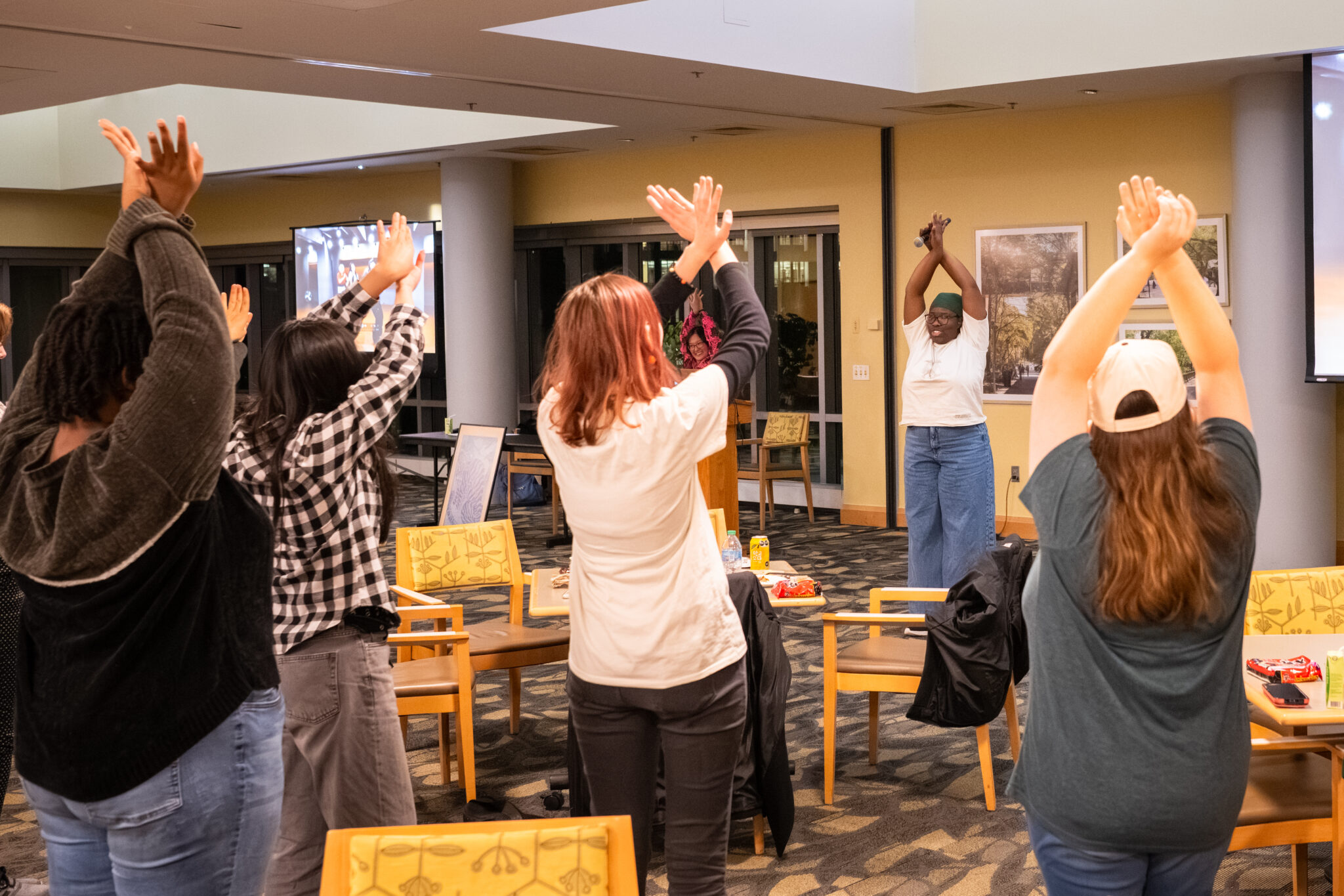 Abbie Fakoya leads faculty, staff, and students in the choreography for the song "Golden," from Netflix's KPop Demon Hunters film. (All photos by Brad Ziegler/UMBC)